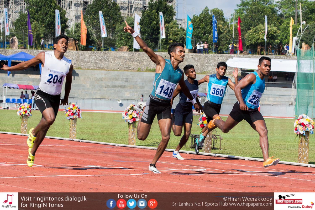 Vinoj Suranjaya crossing the line in first place in the 100M final